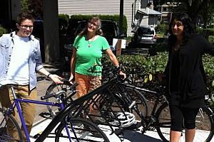 VSAC staff Alyx, Barb and Gagan happily showing off new bike rack at VSAC office