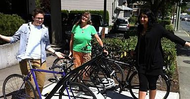 VSAC staff Alyx, Barb and Gagan happily showing off new bike rack at VSAC office